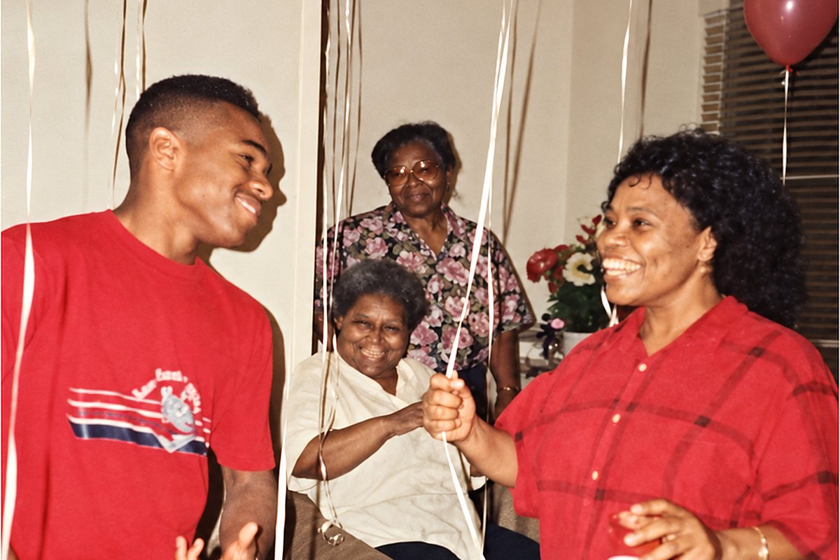 1991. That’s me in the red shirt, laughing with my Aunt Sherry. My Aunt Dorothy is smiling from her chair, and my grandmother, Thelma Palin, is watching over all of us from the back by the window.