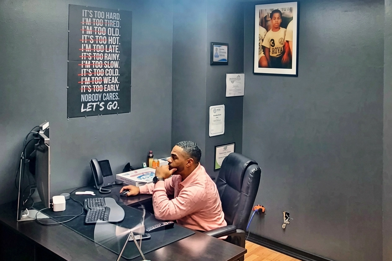 Ramon Darby, owner of Power Restoration of Rockford, organizing insurance claim documentation at his desk